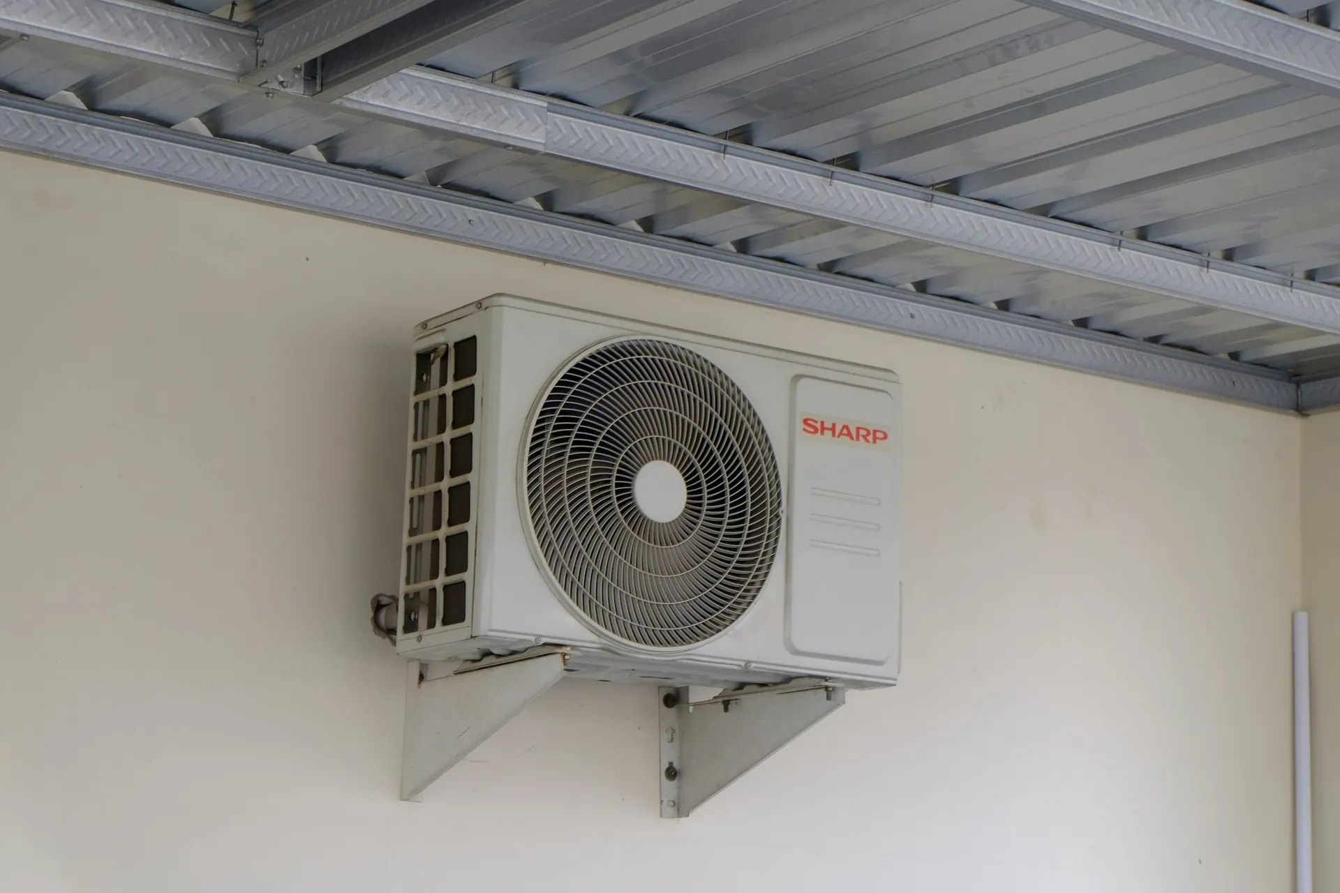 A heat-pump unit mounted on an exterior wall